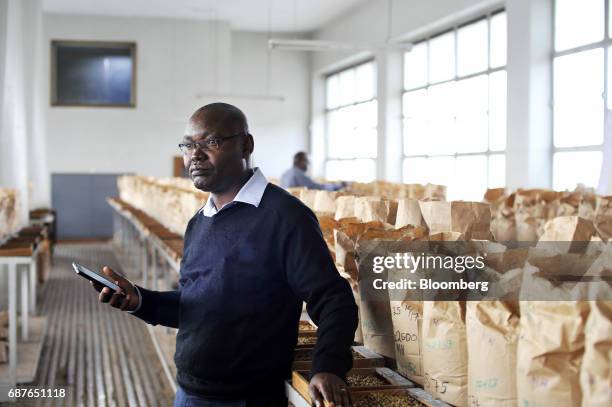 Daniel Mbithi, chief executive officer of the Nairobi Coffee Exchange , poses for a photograph in the NCE samples room in Nairobi, Kenya, on Tuesday,...