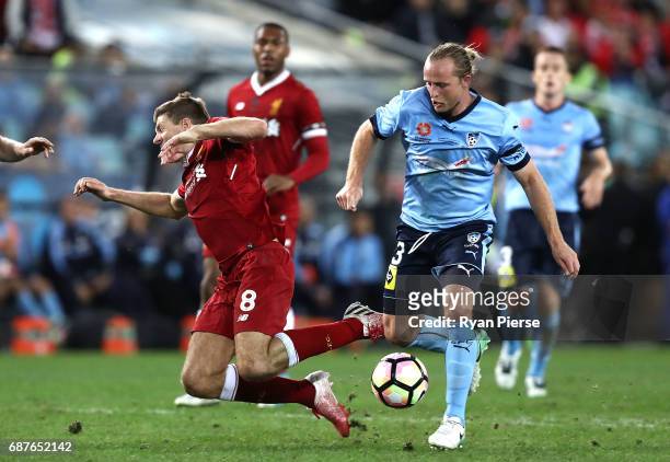 Steven Gerrard of Liverpool is tacked by Rhyan Grant of Sydney FC during the International Friendly match between Sydney FC and Liverpool FC at ANZ...