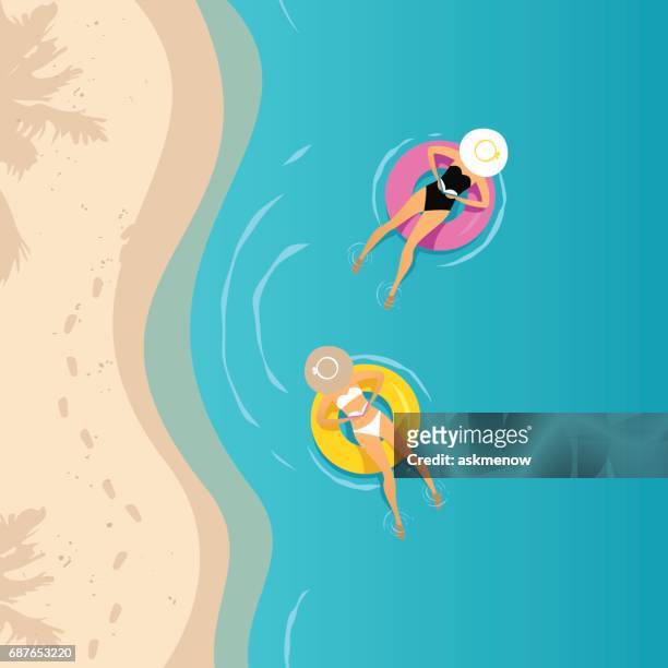 ilustrações de stock, clip art, desenhos animados e ícones de two women swimming on the inflatable ring - boia