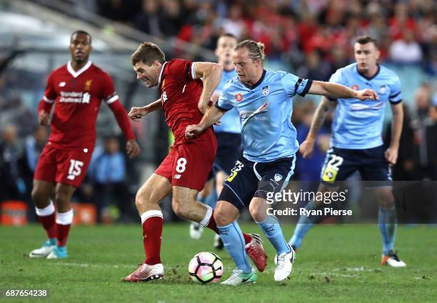 Steven Gerrard of Liverpool is tacked by Rhyan Grant of Sydney FC during the International Friendly match between Sydney FC and Liverpool FC at ANZ...