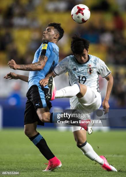 Nicolas Schiappacasse of Uruguay is challenged by Kakeru Funaki of Japan during the FIFA U-20 World Cup Korea Republic 2017 group D match between...