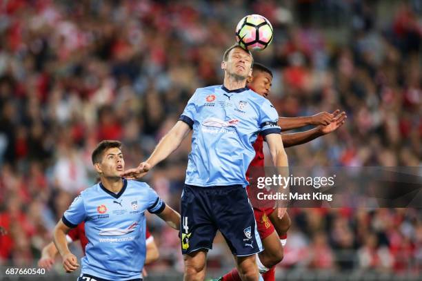 Alex Wilkinson of Sydney FC heads the ball in front of Rhian Brewster of Liverpool during the International Friendly match between Sydney FC and...