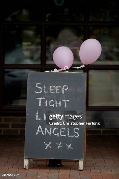 Tribute stands outside a shop in the centre of the Lancashire village of Tarleton, the home village of Georgina Callander and Saffie Rose Roussos who...