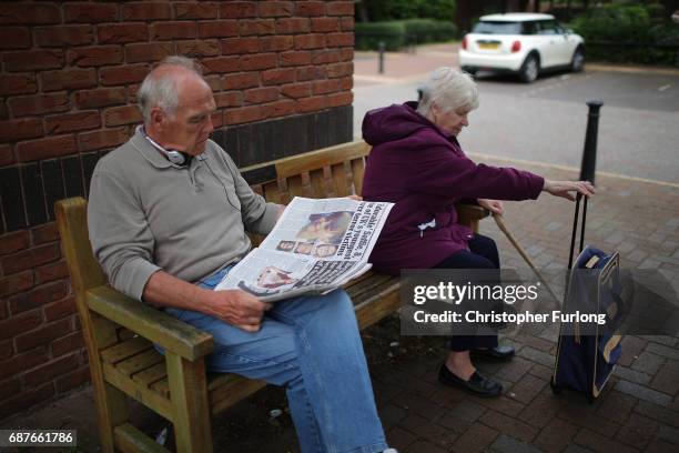 Man reads a newspaper about the Manchester Attack in the centre of the Lancashire village of Tarleton, the home village of Georgina Callander and...