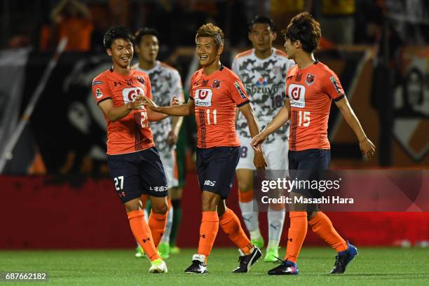 Ryuji Bando and Atsushi Kurokawa of Omiya Ardija celebrate the second goal during the J.League Levain Cup Group A match between Omiya Ardija and...