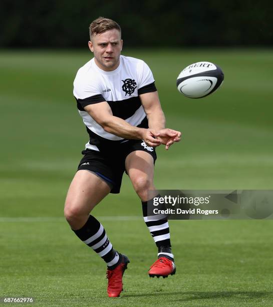 Ian Madigan passes the ball during the Barbarians training sessiond held at Latymers School on May 24, 2017 in London, England.