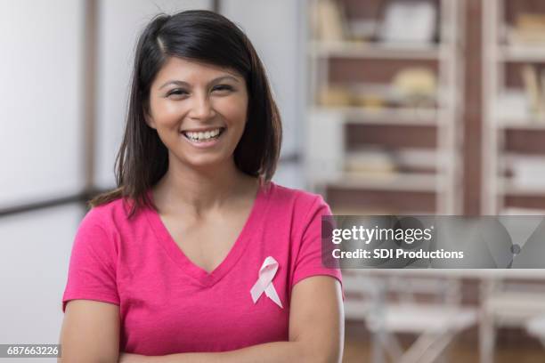 pretty mid adult asian breast cancer patient - pink shirt stock pictures, royalty-free photos & images