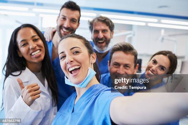 dentist's office in barcelona. medical workers portrait. - nurse selfie stock pictures, royalty-free photos & images