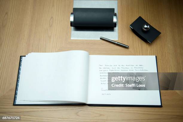 The message of German Chancellor Angela Merkel is displayed in a book of condolence at the British embassy on May 24, 2017 in Berlin, Germany. An...