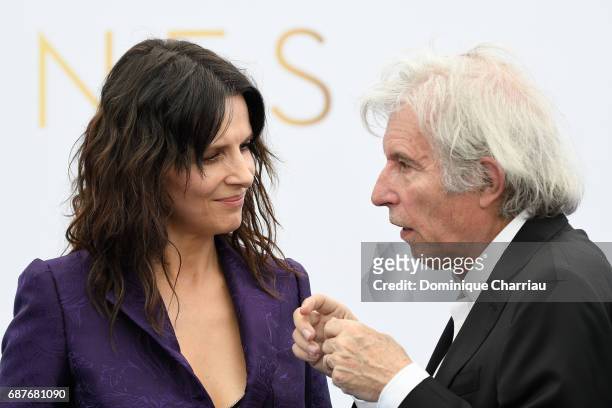 Juliette Binoche and director Jacques Doillon attend the 70th Anniversary photocall during the 70th annual Cannes Film Festival at Palais des...