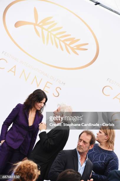 Juliette Binoche and director Jacques Doillon attend the 70th Anniversary photocall during the 70th annual Cannes Film Festival at Palais des...