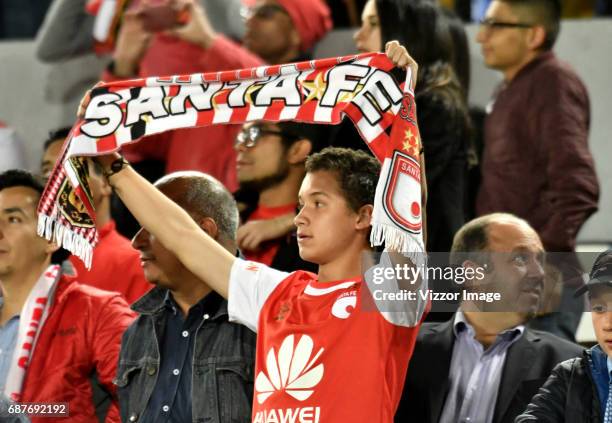 Fan of Independiente Santa Fe hold a scarf of his team during a match between Independiente Santa Fe and The Strongest as part of Copa CONMEBOL...