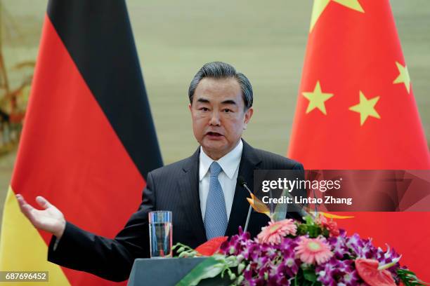 China's Foreign Minister Wang Yi speaks during a joint press conference with German Foreign Minister Sigmar Gabriel at the foreign ministry on May...