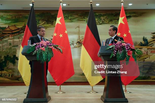 Chinese Foreign Minister Wang Yi with German Foreign Minister Sigmar Gabriel attends a press conference at the foreign ministry on May 24, 2017 in...