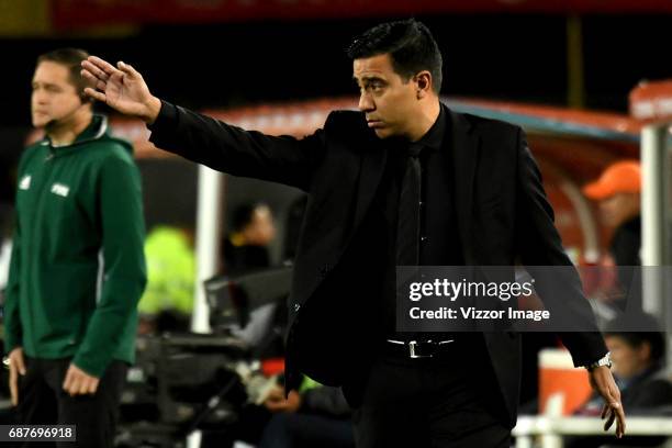 Cesar Farias coach of The Strongest gives instructions to his players during a match between Independiente Santa Fe and The Strongest as part of Copa...