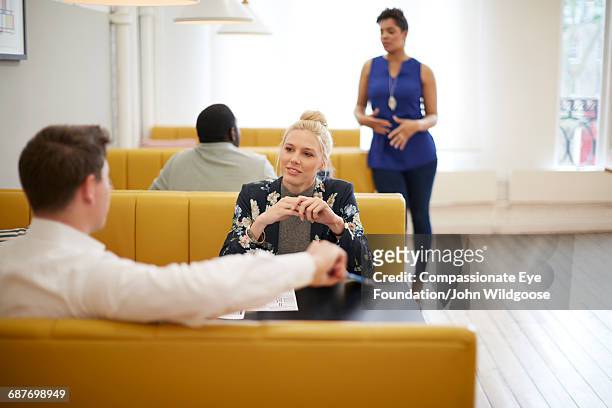creative business people having meeting in cafe - cef stock pictures, royalty-free photos & images