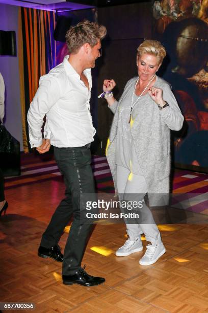 Matthias Pridoehl and Claudia Effenberg dacne during the Kempinski Fashion Dinner on May 23, 2017 in Munich, Germany.
