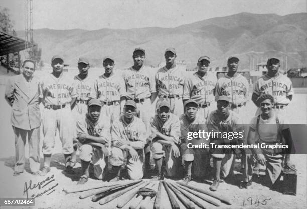 Team portrait of the barnstorming baseball team, American All Stars, as they pose in an unspecified ball park , Caracas, Venezuela, 1945. Among those...
