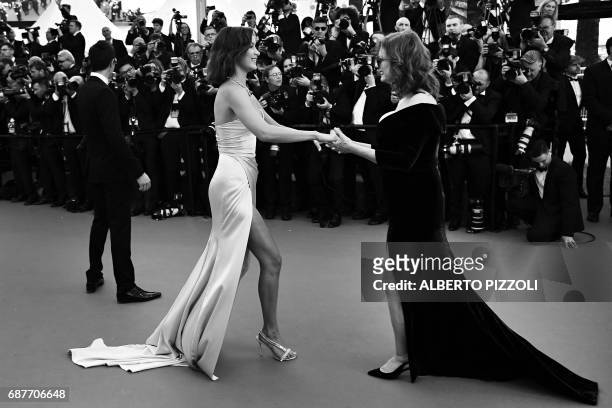 Model Bella Hadid is greeted by US actress Susan Sarandon as she arrives on May 17, 2017 for the screening of the film 'Ismael's Ghosts' during the...