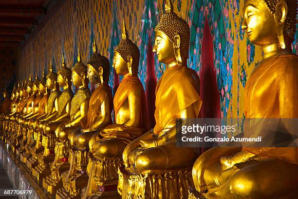 the temple of the dawn in bangkok - buddha stock-fotos und bilder