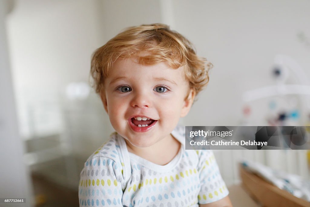 A 15 months old boy smiling