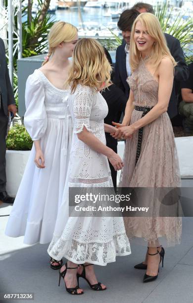 Elle Fanning, Nicole Kidman and Kirsten Dunst attend the "The Beguiled" Photocall during the 70th annual Cannes Film Festival at Palais des Festivals...