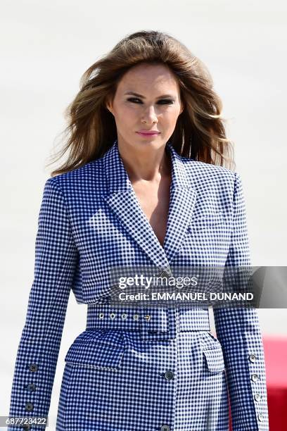 First Lady Melania Trump walks upon arrival at the Melsbroek military airport in Steenokkerzeel on May 24, 2017. - US President Donald Trump arrived...