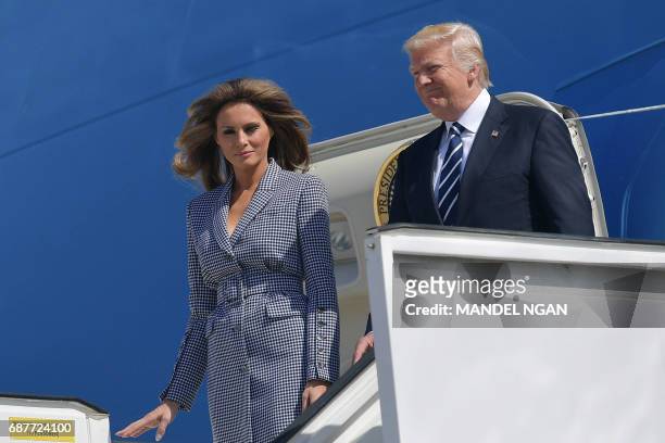 President Donald Trump and US First Lady Melania Trump step off Air Force One upon their arrival at the Melsbroek military airport in Steenokkerzeel...