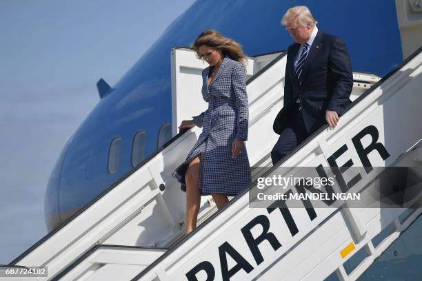 President Donald Trump and US First Lady Melania Trump step off Air Force One upon their arrival at the Melsbroek military airport in Steenokkerzeel...