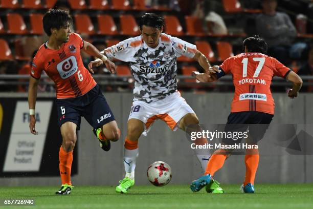 Yu Hasegawa of Shimizu S-Pulse,Akinari Kawazura and Shigeru Yokotani of Omiya Ardija compete for the ball during the J.League Levain Cup Group A...