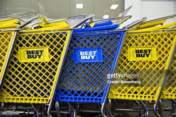 Shopping carts sit lined up at the entrance of a Best Buy Co. Store in Downers Grove, Illinois, U.S., on Tuesday, May 23, 2017. Best Buy Co. Is...