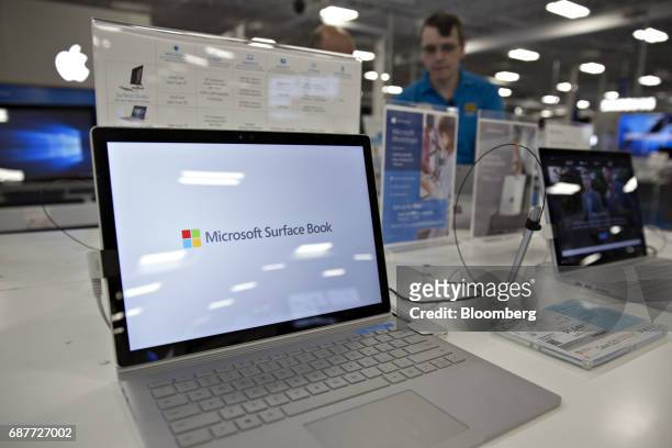 Microsoft Corp. Surface Book computer sits on display at a Best Buy Co. Store in Downers Grove, Illinois, U.S., on Tuesday, May 23, 2017. Best Buy...