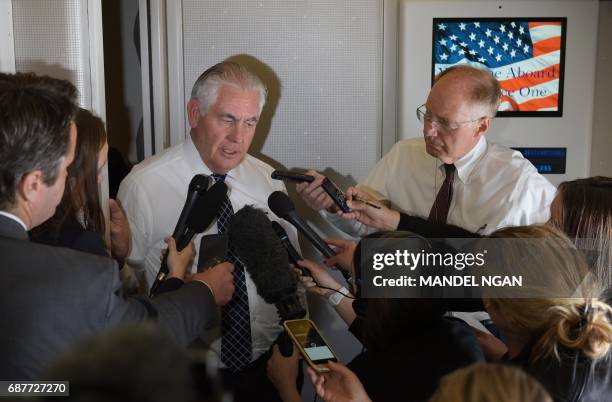 Secretary of State Rex Tillerson speaks to reporters aboard Air force One shortly before arriving in Brussels on May 24, 2017. US President Donald...