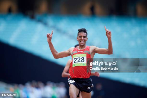 4th Islamic Solidarity Games: Morocco Youness Essalhi victorious, in action during Men's 5000M Final at Baku National Stadium. Baku, Azerbaijan...