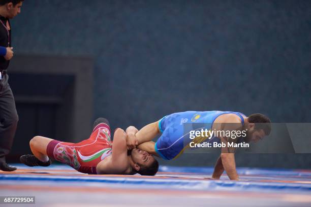 4th Islamic Solidarity Games: Kazakhstan Mamed Ibragimov vs Iran Amir Mohammadi during the Men's Freestyle 97 kg Semifinals match at Heydar Aliyev...