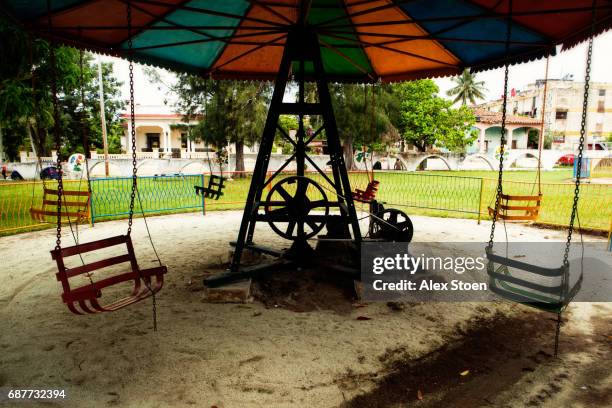 old merry-go-round in cuba - parque infantil stock pictures, royalty-free photos & images