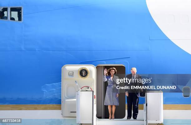 President Donald Trump and First Lady Melania Trump step off the Air Force One upon arrival at Melsbroek military airport in Steenokkerzeel on May...