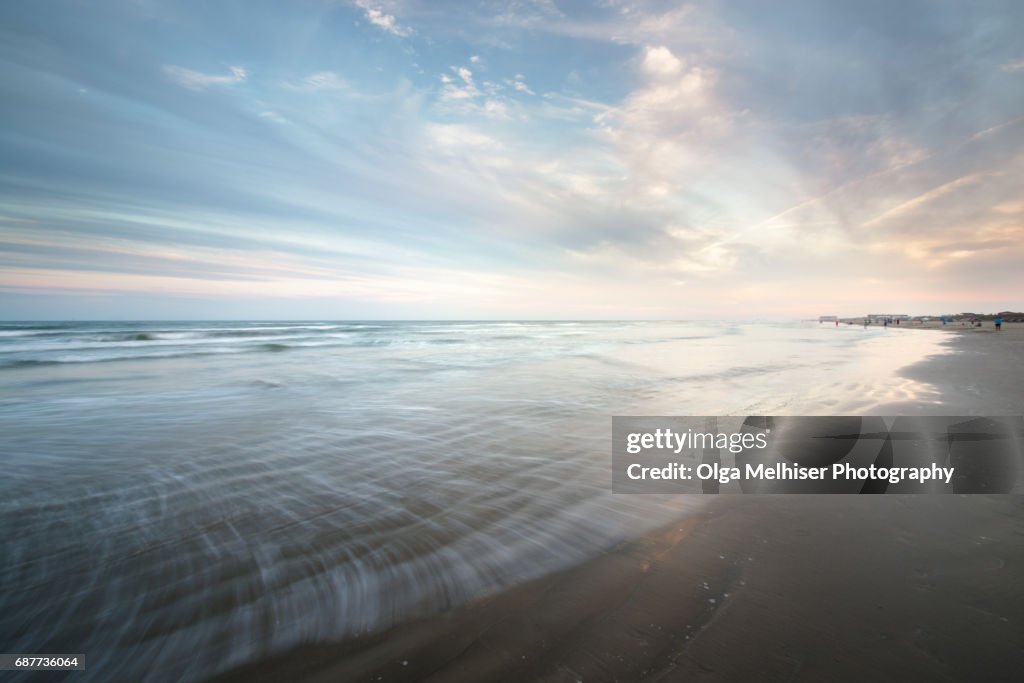 Smooth water at the beach in Port Aransas at sunset, Texas, USA