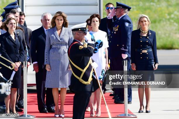 First Lady Melania Trump and Amelie Derbaudrenghien, partner of Belgian Prime Minister stand at Melsbroek military airport in Steenokkerzeel on May...