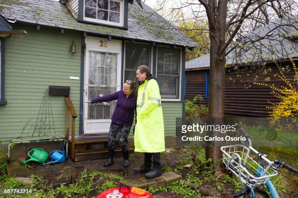 Mayor John Tory spoke with Wards Island resident Alison Gzowski about the water levels around her home. Toronto Mayor John Tory visited the Wards...