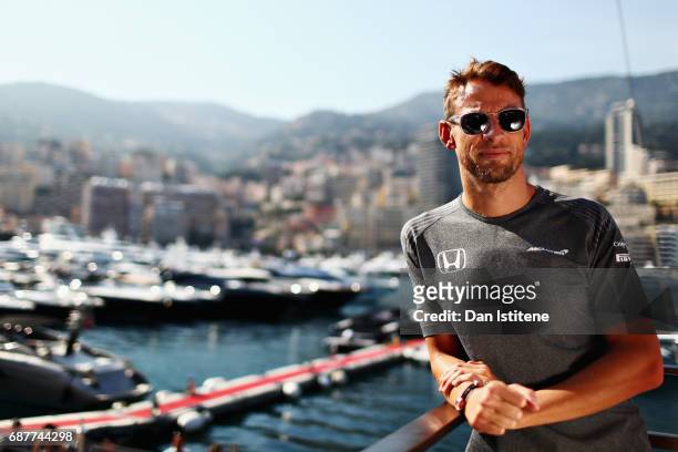 Jenson Button of Great Britain and McLaren Honda poses for a portrait over looking the harbour during previews for the Monaco Formula One Grand Prix...