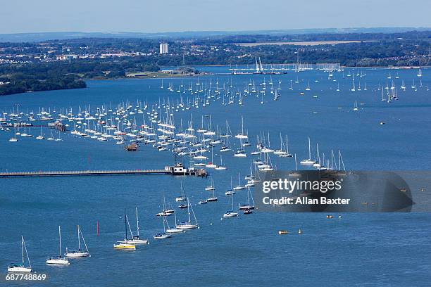 aerial view of yachts in portsmouth harbour - portsmouth england stockfoto's en -beelden