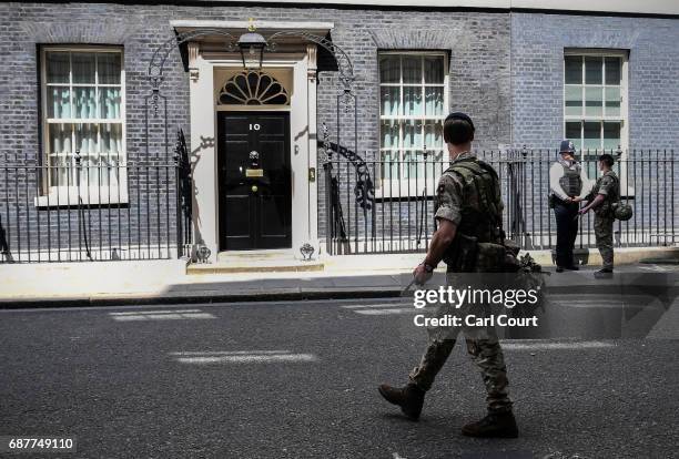 Armed soldiers patrol on Downing Street on May 24, 2017 in London, England. 984 military personnel are being deployed around the country as the UK...