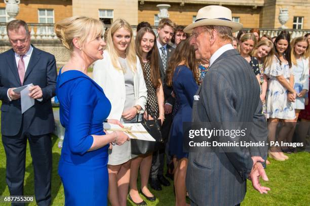 The Duke of Edinburgh meets Carol Kirkwood at the Duke of Edinburgh's Award gold award presentations, at Buckingham Palace, London.