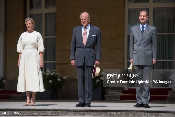 The Duke of Edinburgh and the Earl and Countess of Wessex at the Duke of Edinburgh's Award gold award presentations, at Buckingham Palace, London.