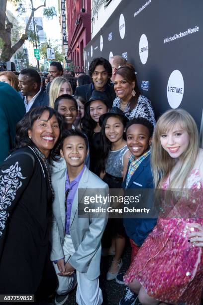 Actor Navi arrives with children from his foundation at the Lifetime Hosts Fan Gala And Advance Screening For "Michael Jackson: Searching For...