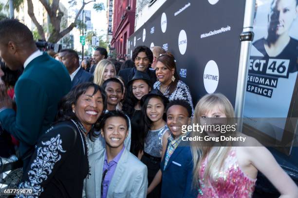 Actor Navi arrives with children from his foundation at the Lifetime Hosts Fan Gala And Advance Screening For "Michael Jackson: Searching For...