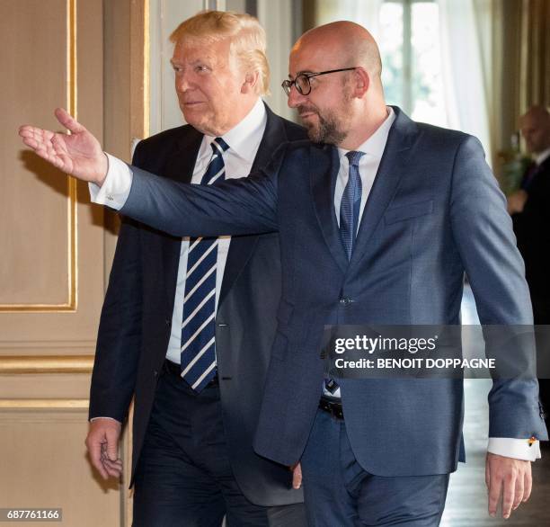 President Donald Trump is welcomed by Belgian Prime Minister Charles Michel prior to a meeting on May 24, 2017 in Brussels. US President Donald Trump...