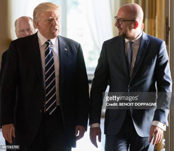 President Donald Trump is welcomed by Belgian Prime Minister Charles Michel prior to a meeting on May 24, 2017 in Brussels. US President Donald Trump...