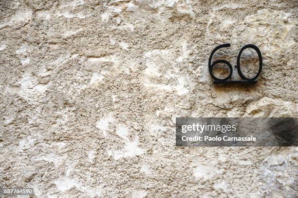 house number on wall - house number stock pictures, royalty-free photos & images